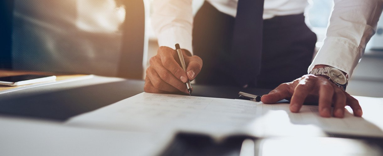 Man signing a document